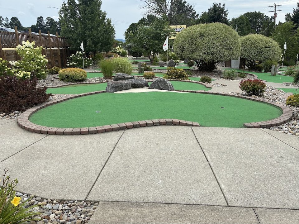 Mini golf area near the restaurant entrance.